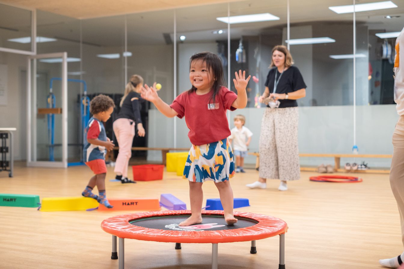 Playgroup kid is jumping at the class