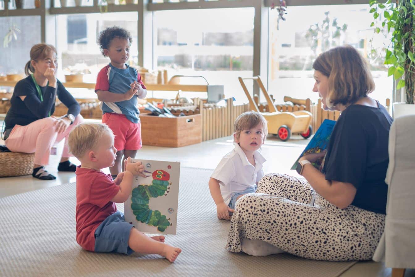 Teacher is telling stories to playgroup kids