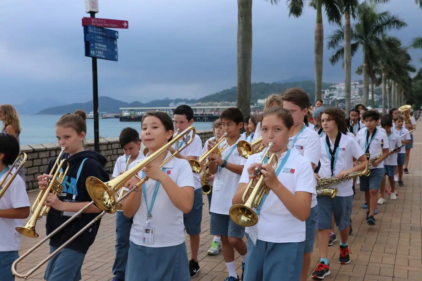 Students are playing instruments along the costal line